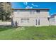 Exterior of home featuring a lush backyard with a white fence and lots of open space at 2024 Bearing Ln, Kissimmee, FL 34744