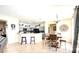 Open concept living room and kitchen with tile flooring, gray cabinets, and updated appliances at 2024 Bearing Ln, Kissimmee, FL 34744