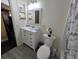 Clean bathroom features a modern white vanity, tile flooring and bathtub with shower at 204 Canary Island Cir, Davenport, FL 33837