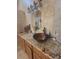 Bathroom vanity with a vessel sink and decorative lighting fixture above the counter at 204 Canary Island Cir, Davenport, FL 33837