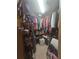 Walk-in closet with shelves, hanging rods, and storage for clothes, shoes, and accessories at 204 Canary Island Cir, Davenport, FL 33837