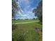 Expansive golf course featuring lush green fairways and manicured grounds, perfect for recreation and relaxation at 204 Canary Island Cir, Davenport, FL 33837