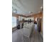 Spacious kitchen with white cabinetry, stainless appliances and center island at 204 Canary Island Cir, Davenport, FL 33837