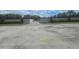 Paved RV storage lot with secure perimeter fencing and landscaping at 204 Canary Island Cir, Davenport, FL 33837