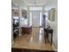Welcoming foyer with neutral tile flooring, a transom window above the front door, and classic furniture, creating a warm entrance at 2141 Fawn Meadow Cir, St Cloud, FL 34772
