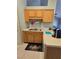 Functional kitchen space with light wood cabinetry, a stainless steel sink, and ample counter space, ideal for meal preparation at 2141 Fawn Meadow Cir, St Cloud, FL 34772