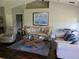 Comfortable living room with stylish furniture, a modern glass coffee table, and hardwood floors, creating a relaxing atmosphere at 2141 Fawn Meadow Cir, St Cloud, FL 34772