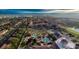 Aerial view of resort pool and community featuring lush landscaping, water features, and a relaxing environment for residents at 226 Verona Ave, Davenport, FL 33897