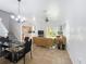 Open-concept living and dining area featuring tile floors and neutral decor at 226 Verona Ave, Davenport, FL 33897