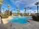 Community pool area with palm trees, umbrellas, and a shallow wading area at 226 Verona Ave, Davenport, FL 33897
