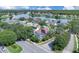 Aerial view showing the home's swimming pool and its proximity to a lake and neighborhood at 2402 Raven Croft Ct, Orlando, FL 32837