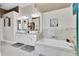 The luxurious primary bathroom features dual sinks, a soaking tub, and granite countertops at 2402 Raven Croft Ct, Orlando, FL 32837