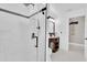 Modern bathroom featuring a glass shower with black hardware and a wood vanity with a white countertop at 2402 Raven Croft Ct, Orlando, FL 32837
