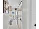 Hallway view of the primary bath with closet, water closet, dual sinks, tub and glass enclosed shower at 2402 Raven Croft Ct, Orlando, FL 32837