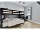 Charming bedroom featuring a bunk bed, hardwood floors, and a cozy study space beneath the top bunk at 2402 Raven Croft Ct, Orlando, FL 32837