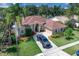 Well maintained single story home with a side entry garage, beautiful landscaping and a paved driveway at 2402 Raven Croft Ct, Orlando, FL 32837