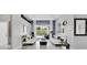 Bright living room with neutral walls, tile floors, white sofas, and sliding glass doors to an outdoor pool area at 2402 Raven Croft Ct, Orlando, FL 32837