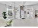 Bright and open living room featuring high ceilings, white tile flooring, and natural light at 2402 Raven Croft Ct, Orlando, FL 32837
