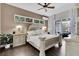Spacious main bedroom with a ceiling fan, hardwood floors and sliding glass doors to the outdoor lanai at 2402 Raven Croft Ct, Orlando, FL 32837