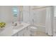 Well-lit bathroom with a vanity, shower with a curtain, and neutral finishes at 2525 Shanti Dr, Kissimmee, FL 34746