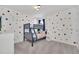 bedroom with Mickey Mouse themed bunk beds and colorful polka dot walls at 2525 Shanti Dr, Kissimmee, FL 34746