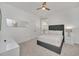 Cozy bedroom showcasing a queen bed, ceiling fan, carpet, and neutral decor at 2525 Shanti Dr, Kissimmee, FL 34746