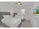 Charming bedroom featuring twin beds, neutral decor, carpet, and ceiling fan at 2525 Shanti Dr, Kissimmee, FL 34746