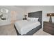 Comfortable bedroom with a queen bed, carpet, closet, and modern lamps at 2525 Shanti Dr, Kissimmee, FL 34746