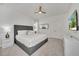 Bedroom featuring a modern bed frame, plush bedding, and neutral decor at 2525 Shanti Dr, Kissimmee, FL 34746
