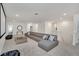 An upstairs bonus room, featuring a seating area and a projector screen at 2525 Shanti Dr, Kissimmee, FL 34746