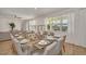 Bright dining area featuring a large table, comfortable seating, and natural light at 2525 Shanti Dr, Kissimmee, FL 34746