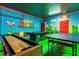 Unique game room featuring Super Mario mural, pool table, and ping pong at 2525 Shanti Dr, Kissimmee, FL 34746