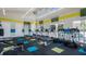 Well-equipped gym with treadmills, ellipticals, weight machines, and plenty of natural light at 2525 Shanti Dr, Kissimmee, FL 34746