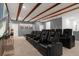Luxury home theater featuring comfortable seating and a large screen at 2525 Shanti Dr, Kissimmee, FL 34746