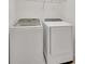 Laundry room with new front-load washer and dryer at 2525 Shanti Dr, Kissimmee, FL 34746