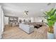 Cozy and stylish living area with a comfortable sectional and seamless flow to the dining at 2525 Shanti Dr, Kissimmee, FL 34746