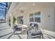 Relaxing patio area featuring comfortable seating and a ceiling fan at 2525 Shanti Dr, Kissimmee, FL 34746