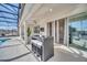 Stylish patio with bar seating, ceiling fan, and access to the pool area at 2525 Shanti Dr, Kissimmee, FL 34746