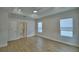 Large bedroom featuring tray ceilings, recessed lights, ceiling fan, and door to en-suite bathroom at 2673 Calistoga Ave, Kissimmee, FL 34741