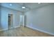 Bright bedroom features wood-look flooring, neutral walls, and provides access to bathroom and other rooms at 2673 Calistoga Ave, Kissimmee, FL 34741