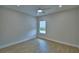 Bright bedroom featuring light wood floors and a sunlit window at 2673 Calistoga Ave, Kissimmee, FL 34741