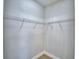 Walk-in closet with white walls, metal shelving, and light wood floors at 2673 Calistoga Ave, Kissimmee, FL 34741