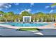 Resort-style community pool featuring crystal-clear water, elegant water features, and tropical landscaping at 2673 Calistoga Ave, Kissimmee, FL 34741