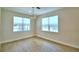 Sunlit dining area featuring wood-look floors and two large windows with views of the neighborhood pool at 2673 Calistoga Ave, Kissimmee, FL 34741
