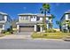 Stunning two-story home with manicured lawn and attached two car garage at 2673 Calistoga Ave, Kissimmee, FL 34741