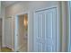 Hallway view showcasing closet and bathroom access with white marble flooring that complements the interior design at 2673 Calistoga Ave, Kissimmee, FL 34741