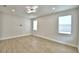 Large, bright living room featuring laminate floors, modern lighting and large windows at 2673 Calistoga Ave, Kissimmee, FL 34741