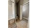 Bathroom featuring tub with shower and tiled floors at 2807 Playing Otter Ct, Kissimmee, FL 34747