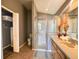 Bathroom features a shower, vanity, and a closet with a door, providing both style and functionality at 2807 Playing Otter Ct, Kissimmee, FL 34747