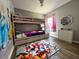 Bright ' bedroom featuring a bunk bed and playful decor at 2807 Playing Otter Ct, Kissimmee, FL 34747